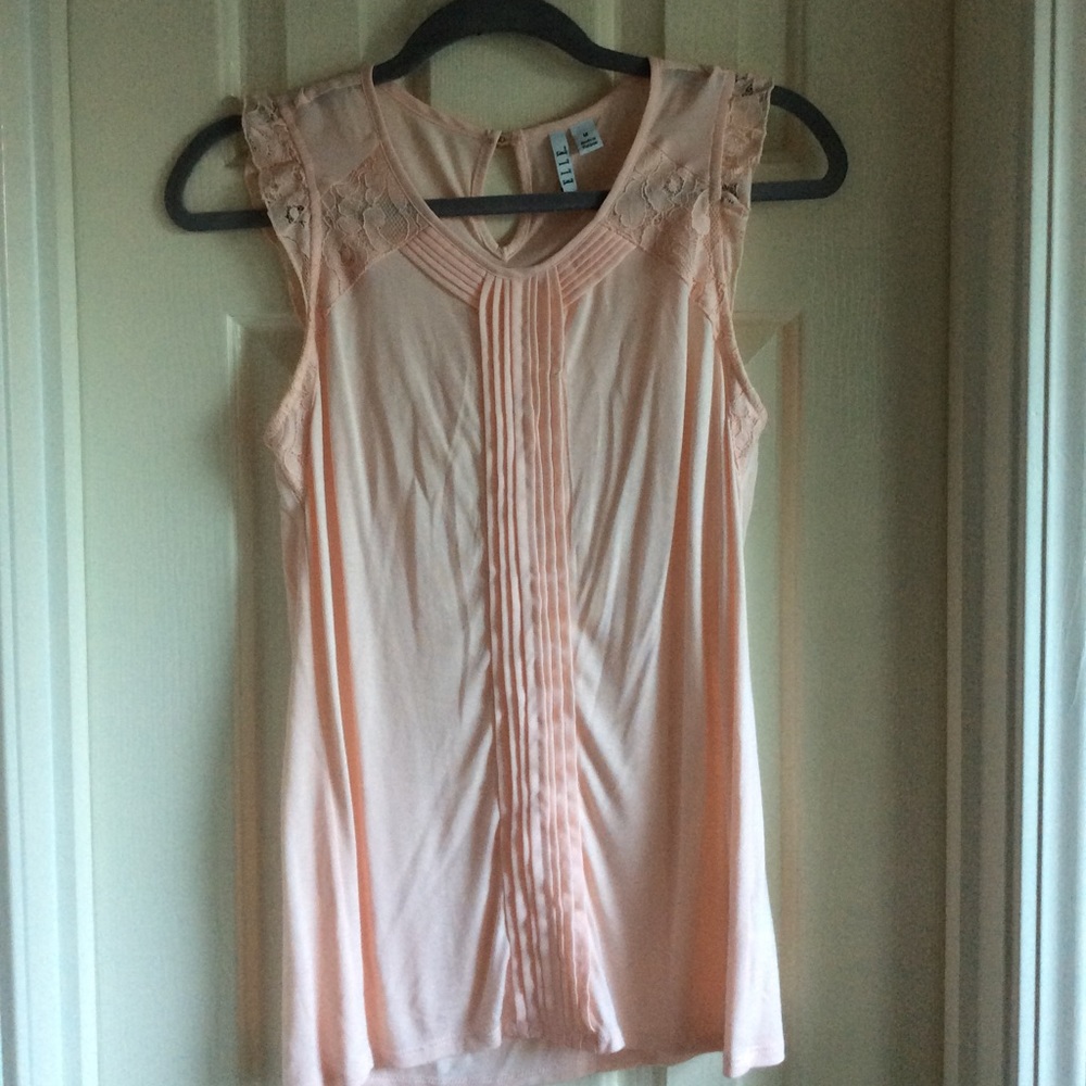 Short-sleeve detailed tank.